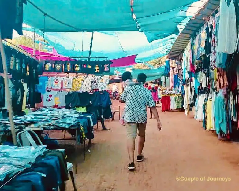 Akshay walking through shops at Vagator