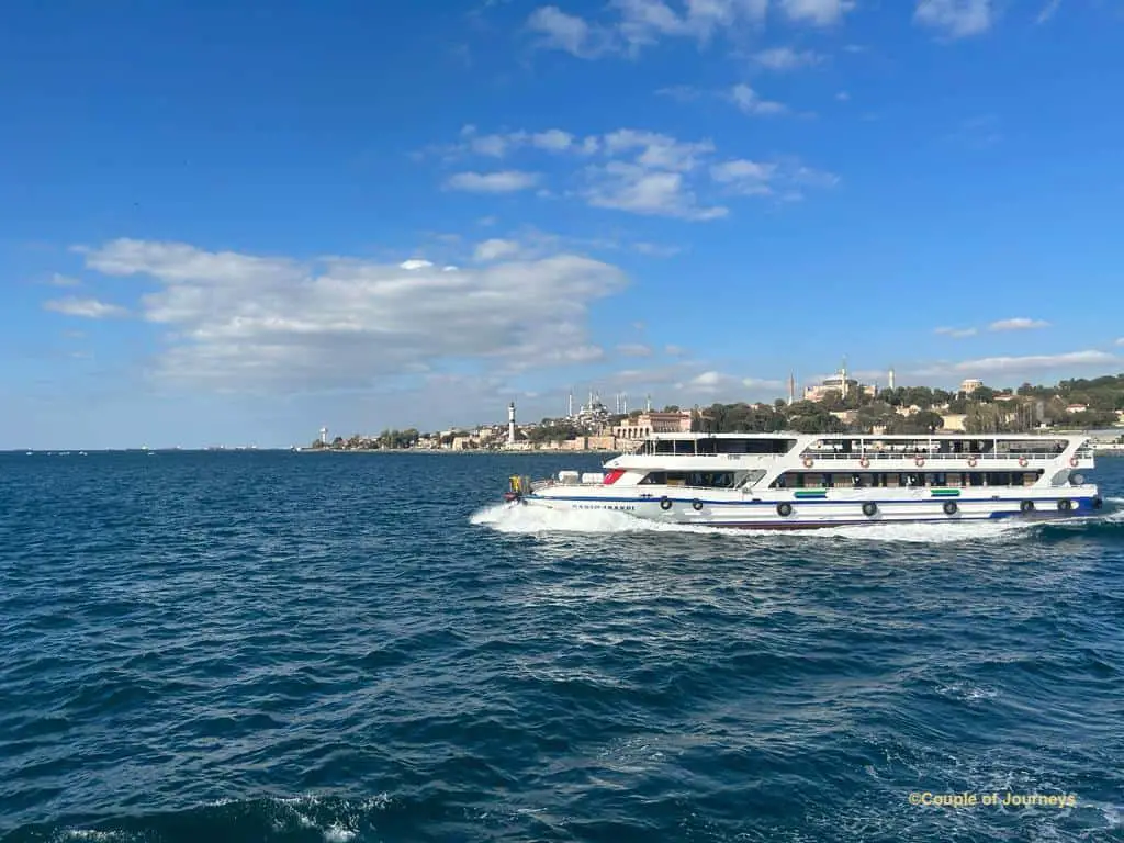 Visiting Istanbul for 4 days tips with a picture of a ferry in the Bosphorus straight