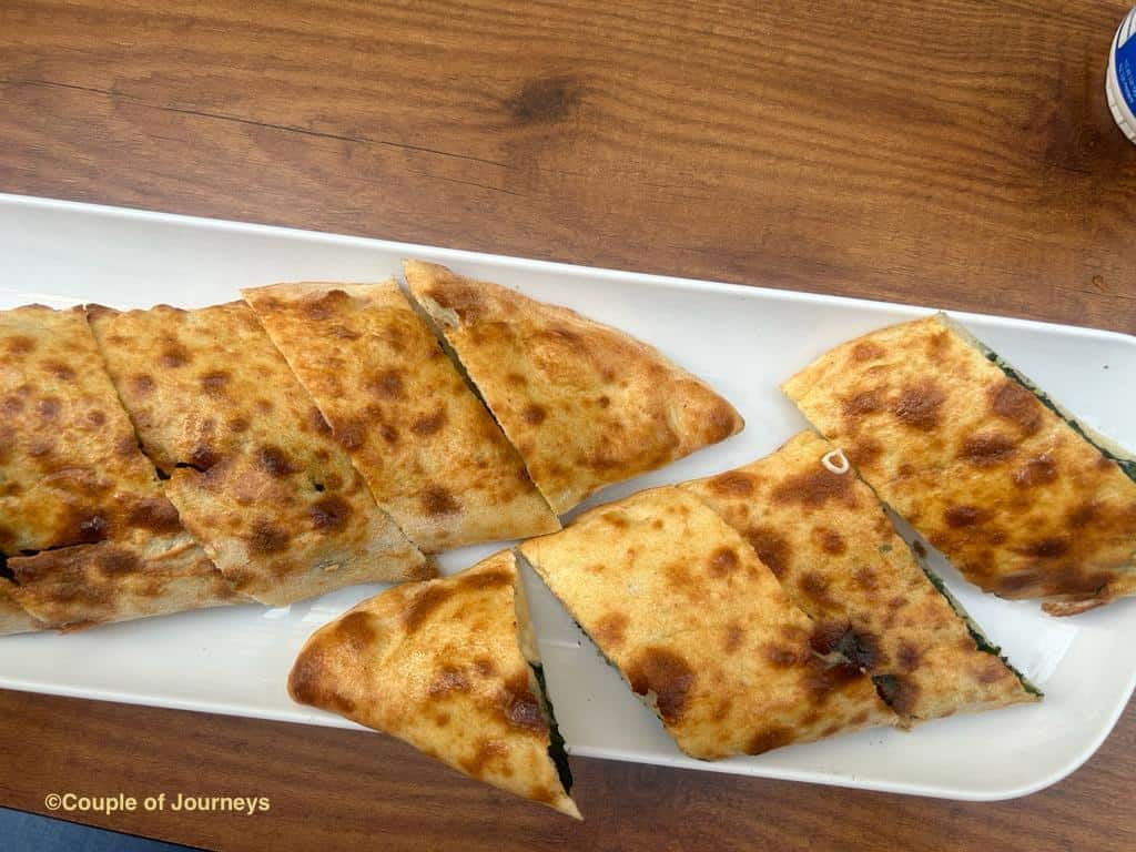 Pide or stuffed turkish pizza at a restaurant table in Istanbul