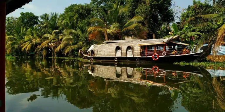 Honeymoon destinations in Kerala - a picture of a houseboat in Kumarakom