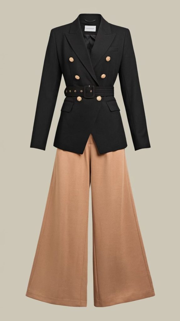 A chic black double-breasted blazer with gold buttons and a belted waist, paired with camel wide-leg culottes, perfect for creating a sophisticated Munich travel outfit.