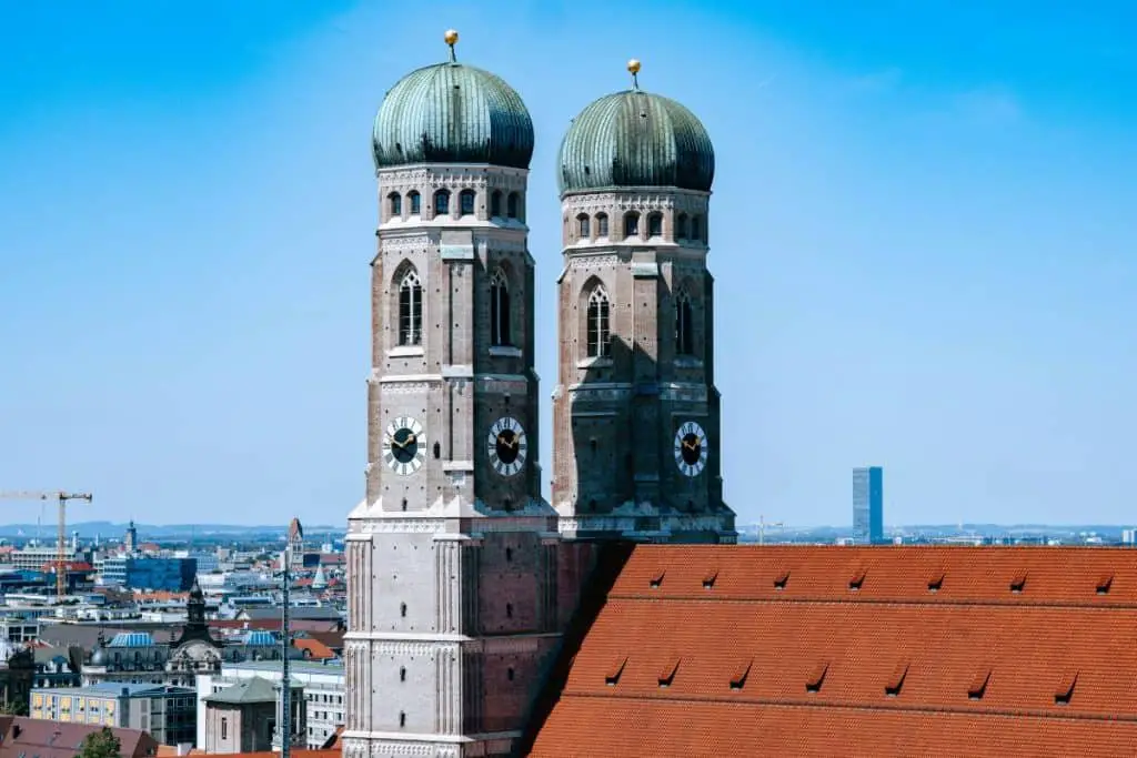 The twin towers of Frauenkirche rising above Munich’s skyline, a symbol of the city's history and architecture. A must-see landmark in a Munich Itinerary 3 Days.