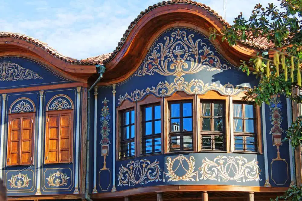  A beautifully decorated traditional Bulgarian house with intricate patterns, showcasing the city's charm as a budget-friendly option for Cheap Travel Destinations in Europe Summer.